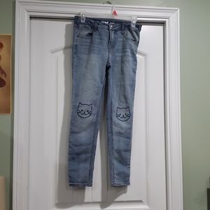 Skinny jeans w/ cats on them